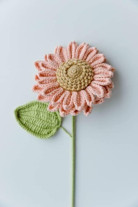 Tiny pink crocheted heart keychain with a gold clasp ring, handmade by Stitchoria.