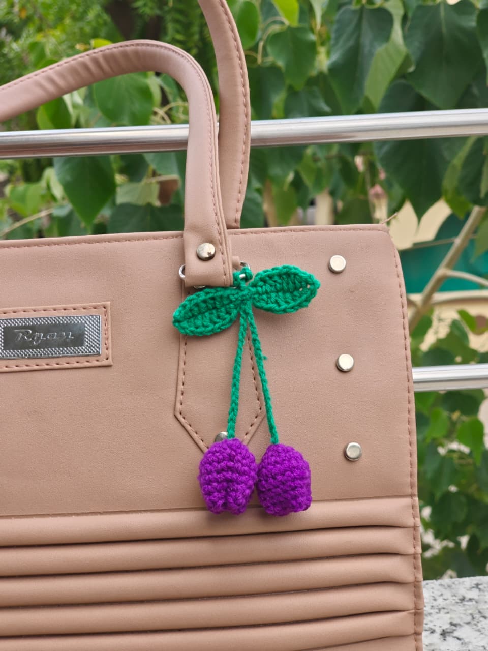 Custom crochet letters spelling a name, assembled as a personalized keychain gift.